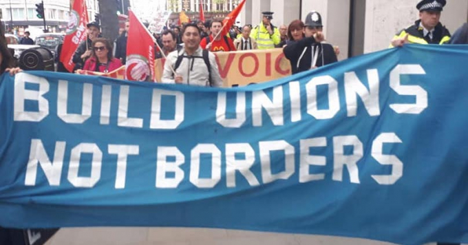 'Build unions not borders' banner