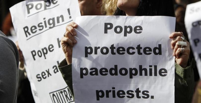 Signs targeting Pope