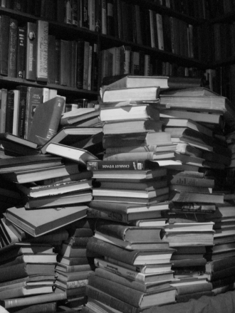 Black and white photo of a stack of books