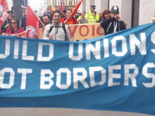 'Build unions not borders' banner