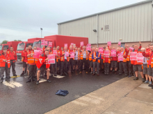 CWU Gate Meeting, with dozens of workers holding up posters saying they were voting "yes"