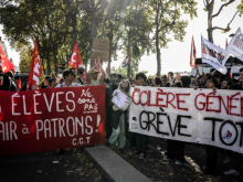 Photo of French protesters with banners supporting strikes