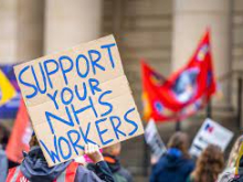 A handwritten placard which says "Support your NHS workers"