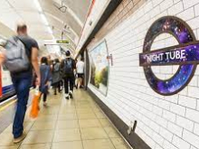 Photo shows a Tube platform with a London Underground roundel reading "Night Tube"