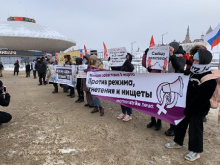 Photo shows socialist-feminists protesters with banners