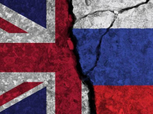 UK and Russian flags as broken wall