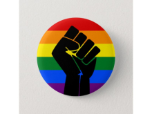 Raised fist on a rainbow background