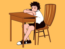 Sad child at school desk