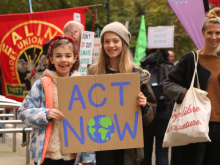 Kids with climate placard