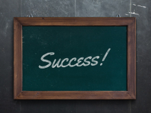 The word "Success!" written on a chalkboard