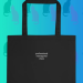 Tote bag inscribed "professional-managerial class"
