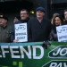 An RMT picket line, with people holding up "RMT official picket" placards